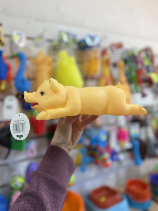 Chancho de goma acostado amarillo