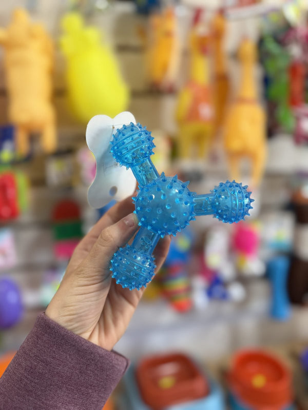 Mordillo trípode con pinches celeste