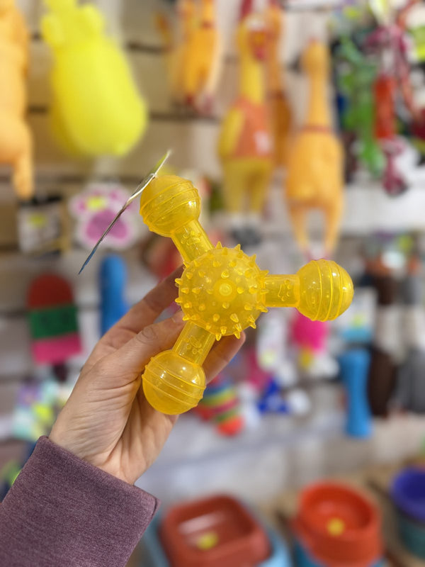 Mordillo trípode con pinches amarillo